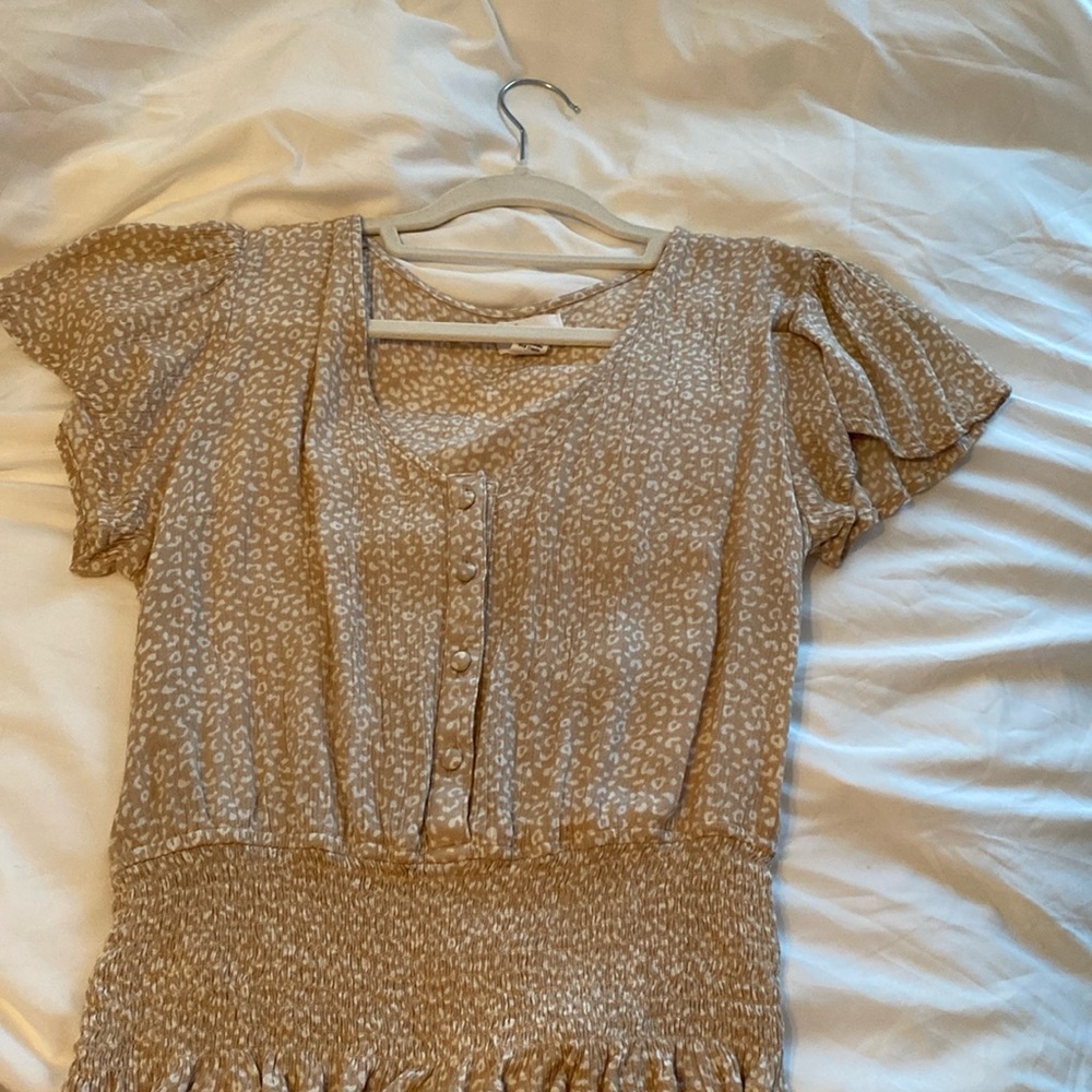 This is a cheers print blouse and is a size small